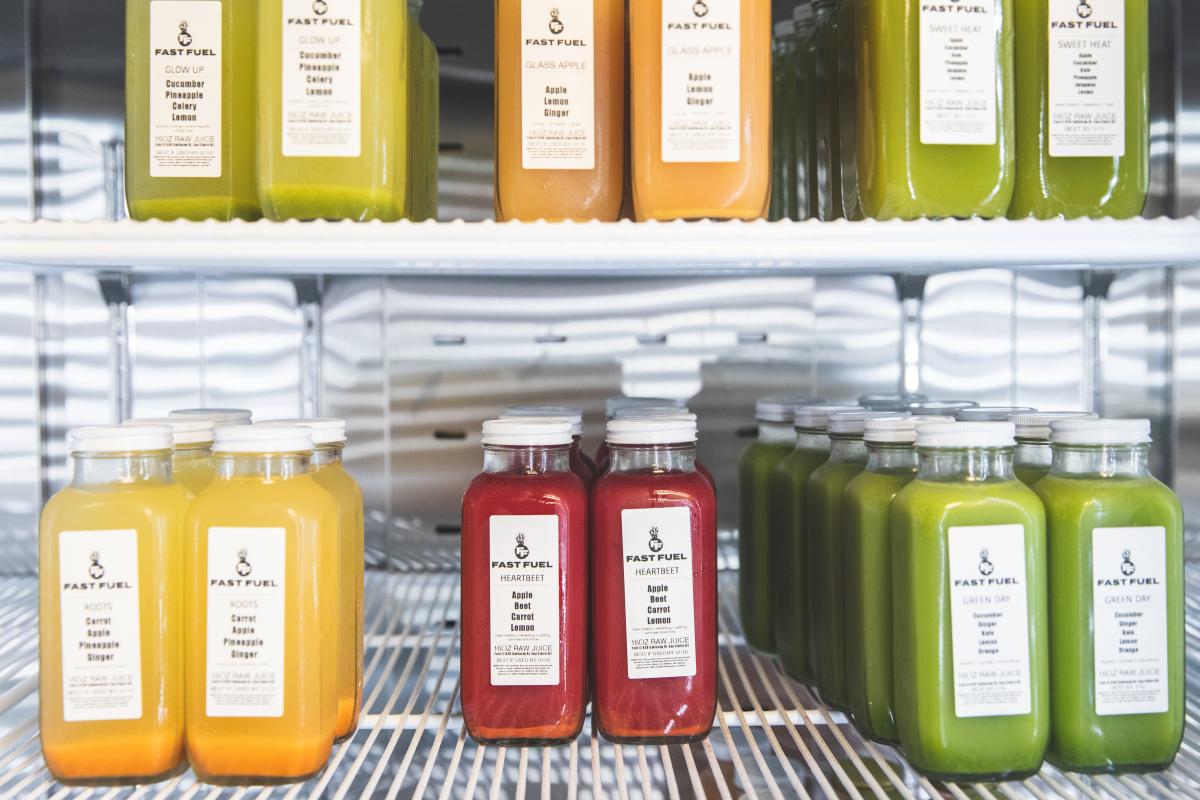 A shelf of colorful juices at Fast Fuel