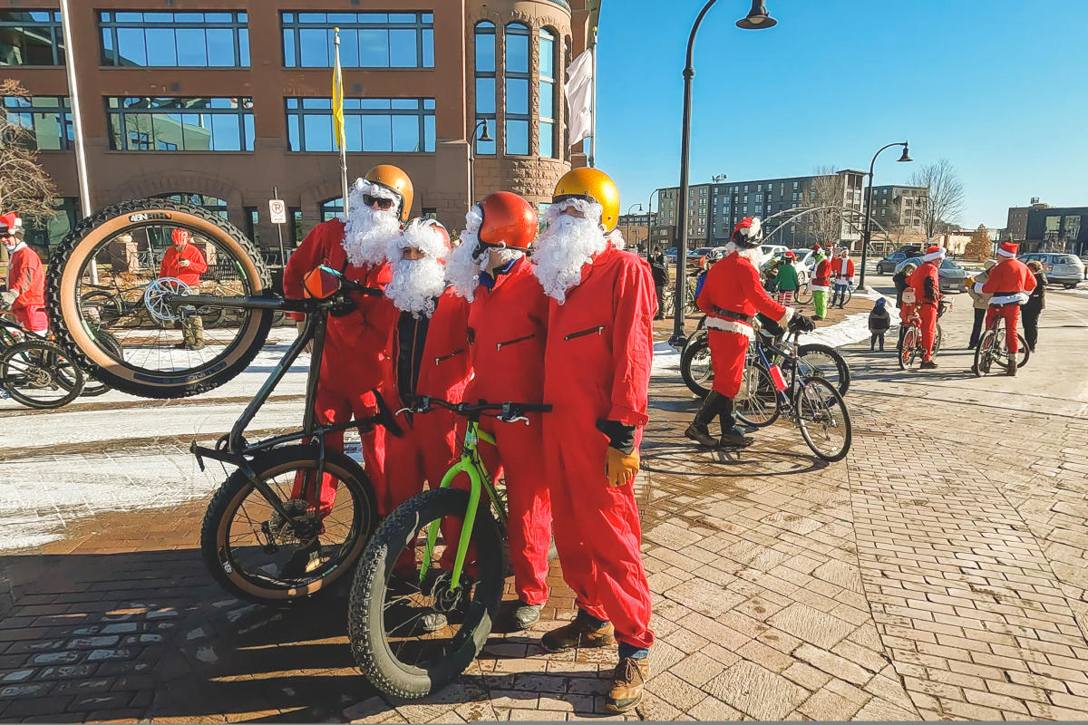 A group of men dressed up in Santa costumes at the Santa Cycle Rampage biking event