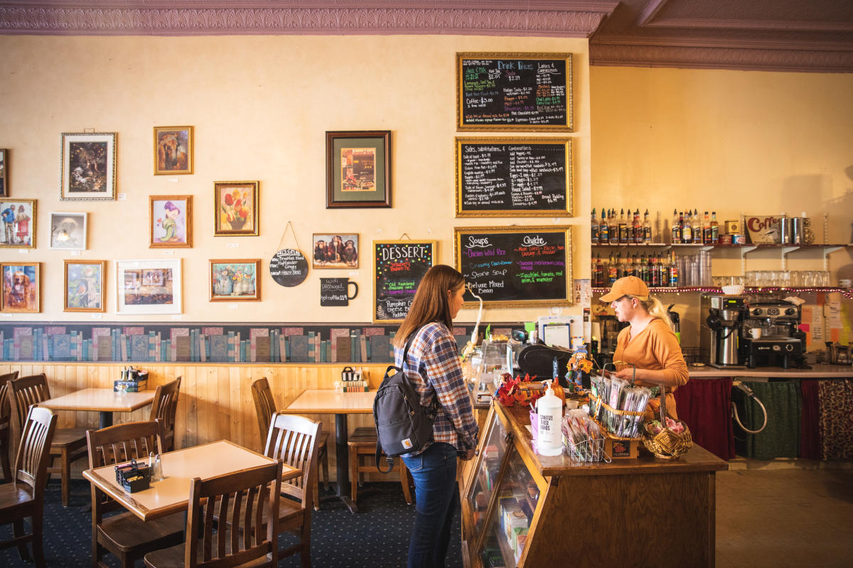 A woman checking out at Grand Avenue Cafe in downtown Eau Claire