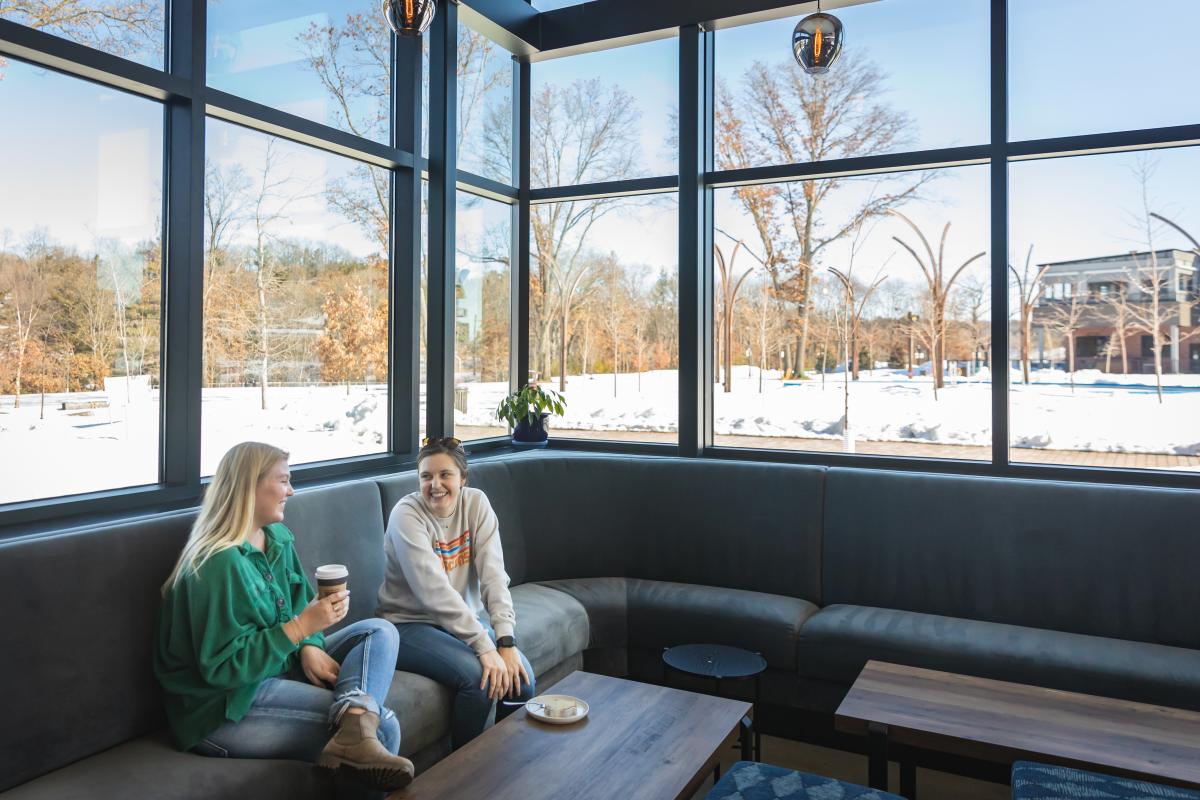 Two women grabbing coffee and a bite to eat for brunch in River Prairie in Altoona, WI