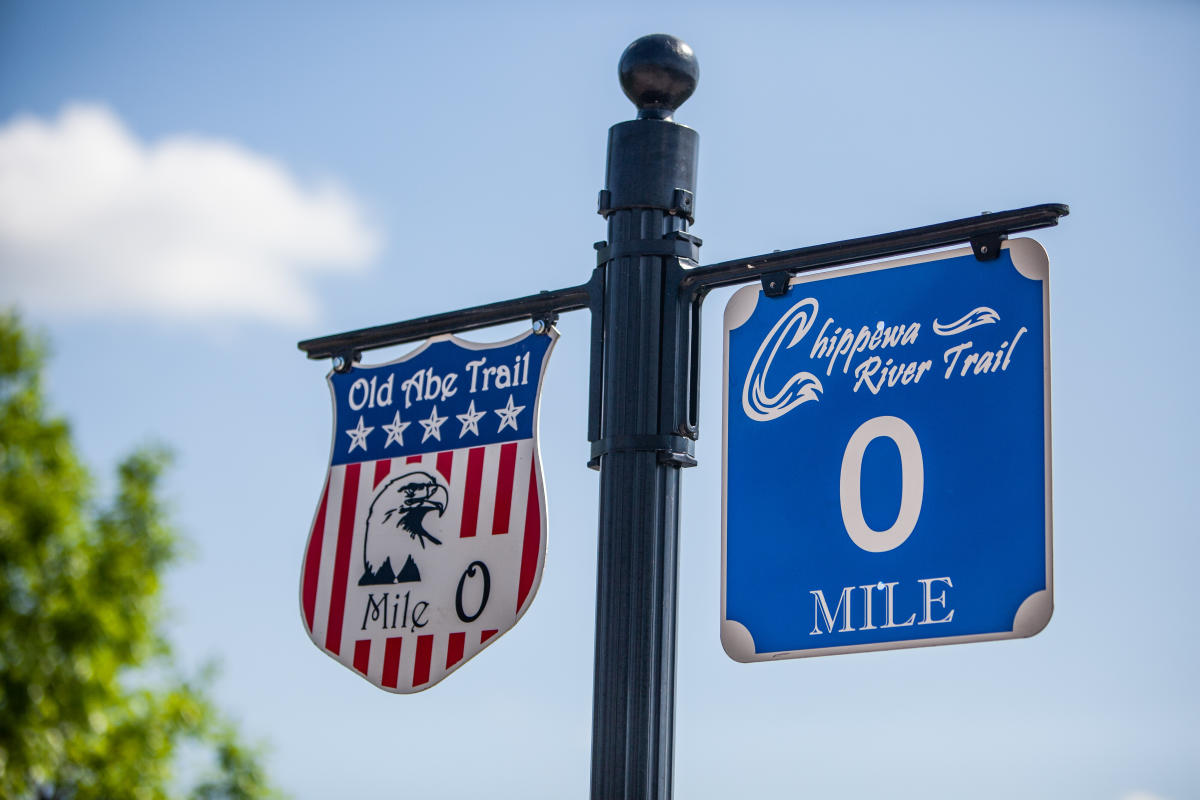 Signs for the start of the Chippewa River State Trail and the Old Abe State Trail