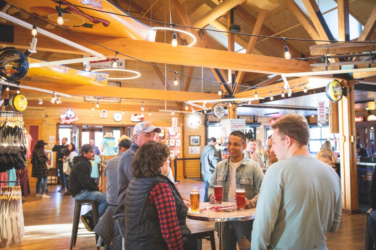 A group of 4 friends enjoying beer at the Leinie Lodge