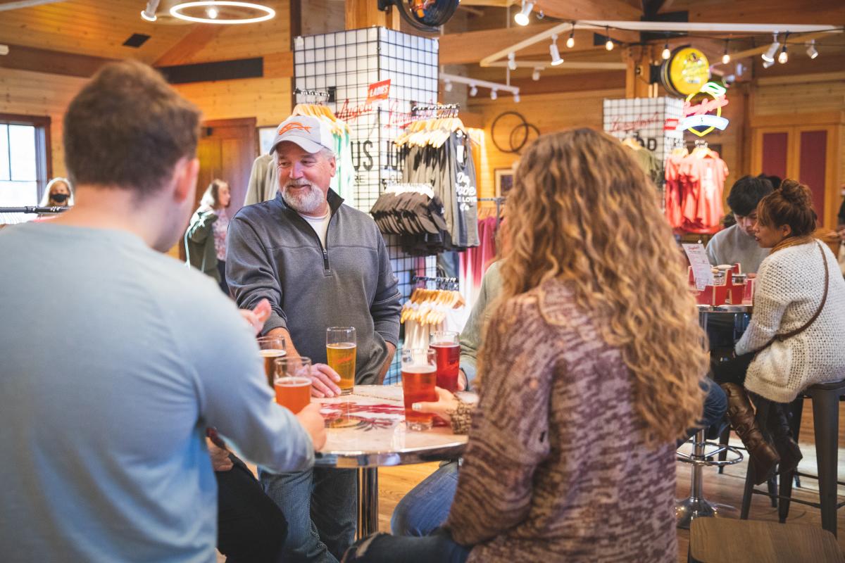 A group enjoying pints of beer at the Leinie Lodge