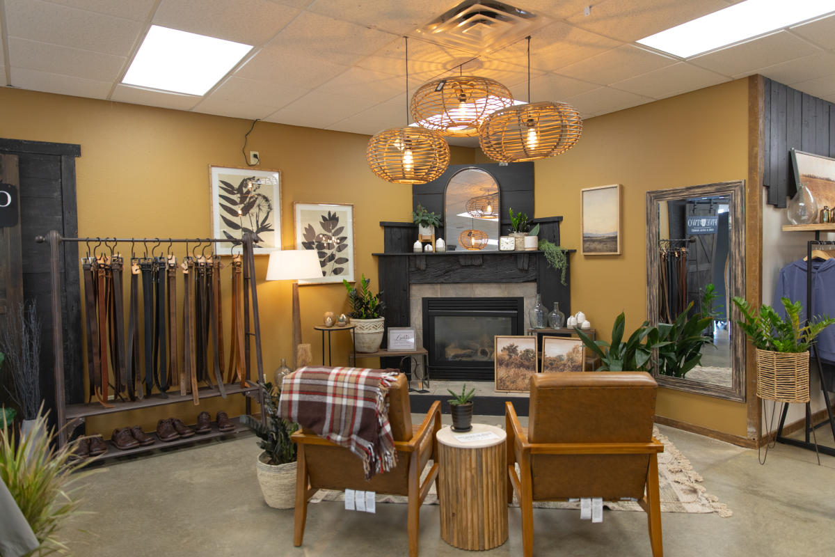 A photo of a fireplace and merchandise for sale at John Scott Men's Apparel
