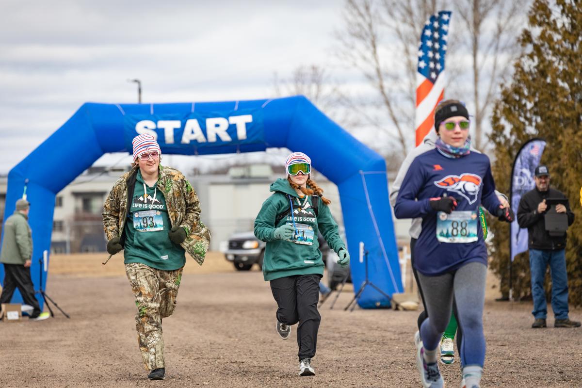 Racers running at the Snowshoe Championships