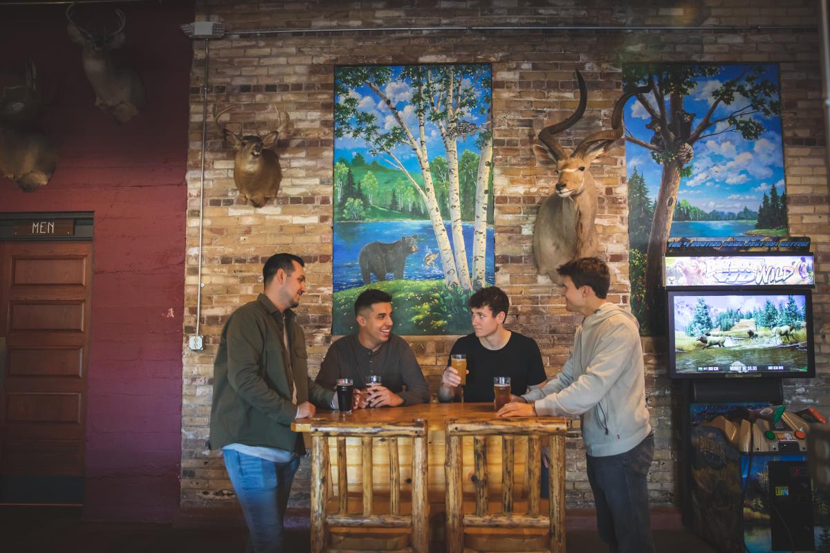 Four men having beer at Northwoods Brewpub in Osseo