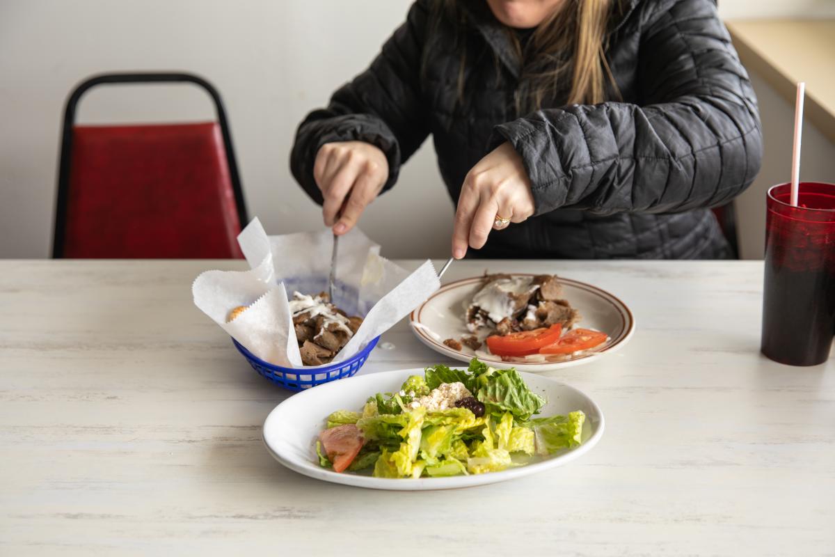 A photo of a salad and gyro at Olympic Flame