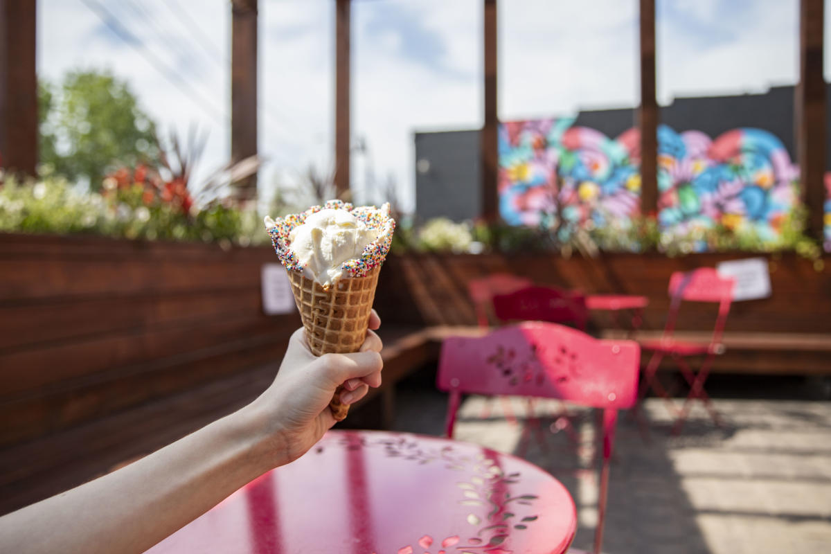 Holding up ice cream at Ramone's