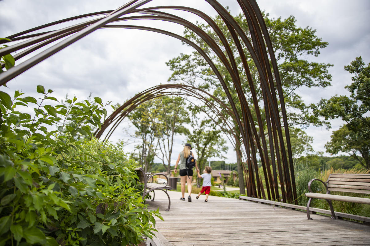 Mom and son walking through River Prairie