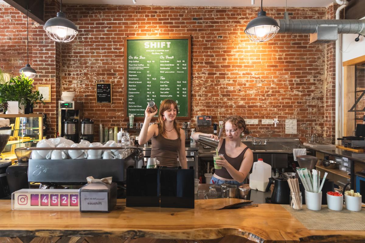 Two baristas making coffee orders at Shift