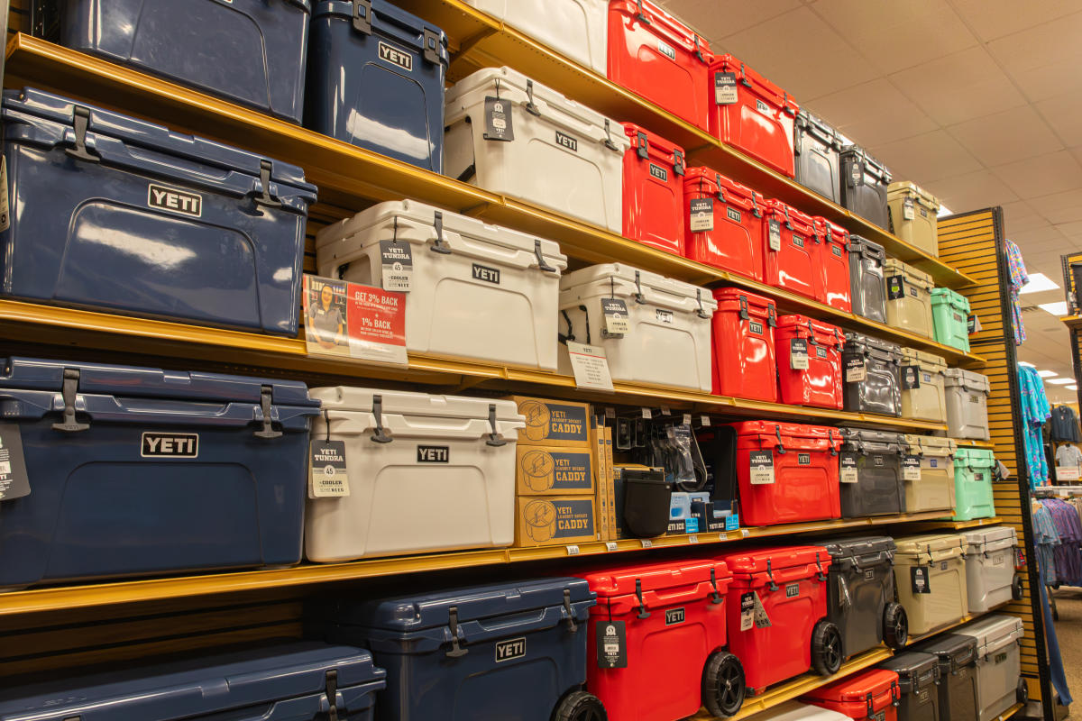 A photo of red, white, and blue Yeti coolers on the shelves at Scheels