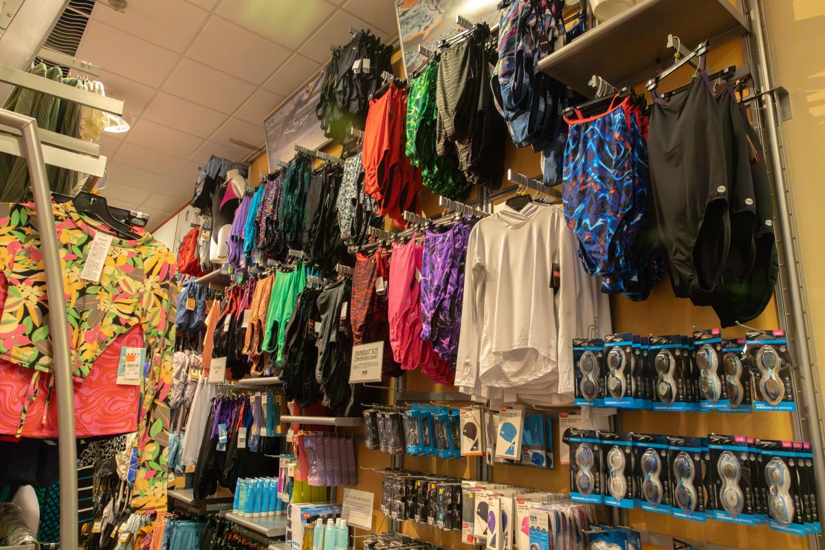 A photo of swimsuits and swim accessories available at Scheels