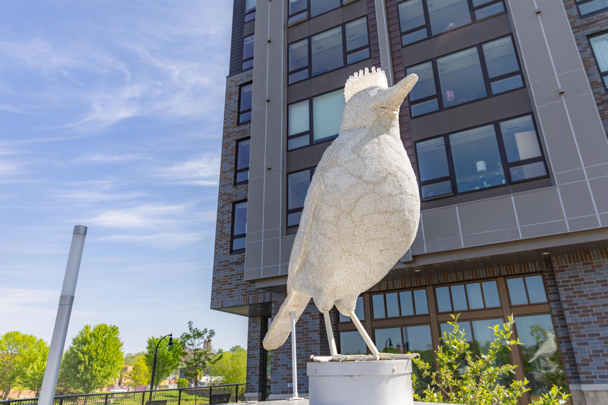 A photo of a white bird sculpture at Haymarket Plaza