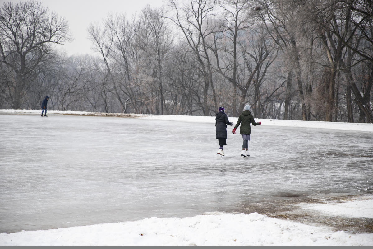 People ice skating at Boyd Park in the winter
