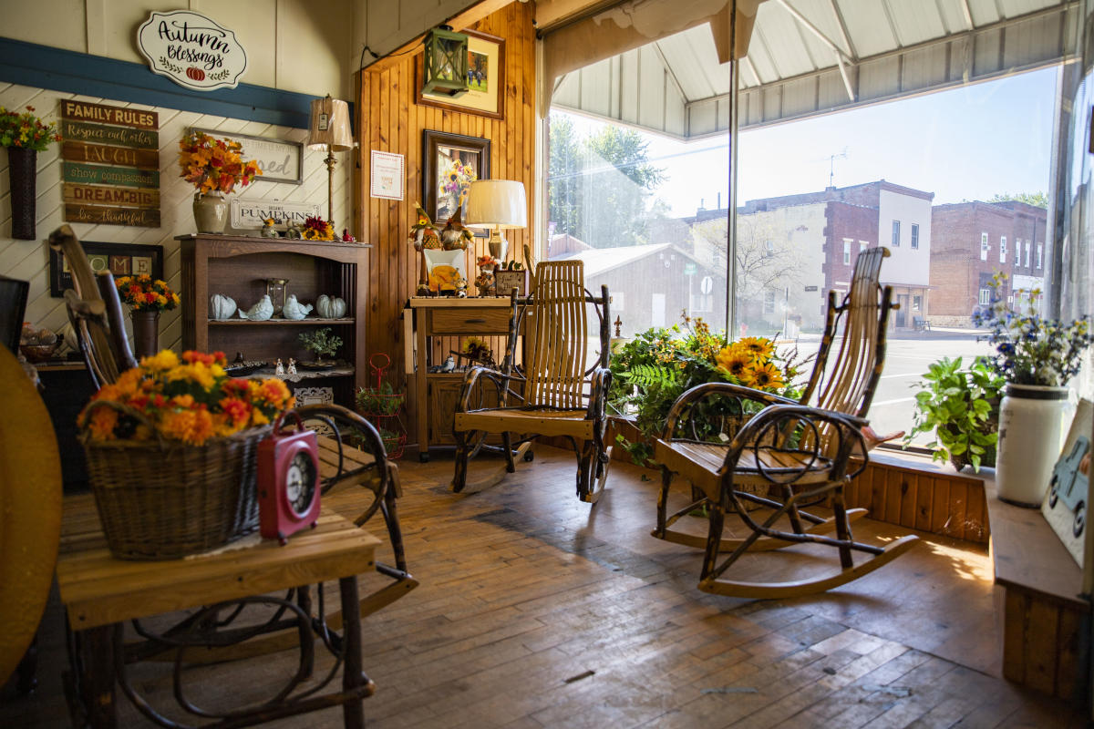 a photo inside the wood shed store of rocking chairs and other decor