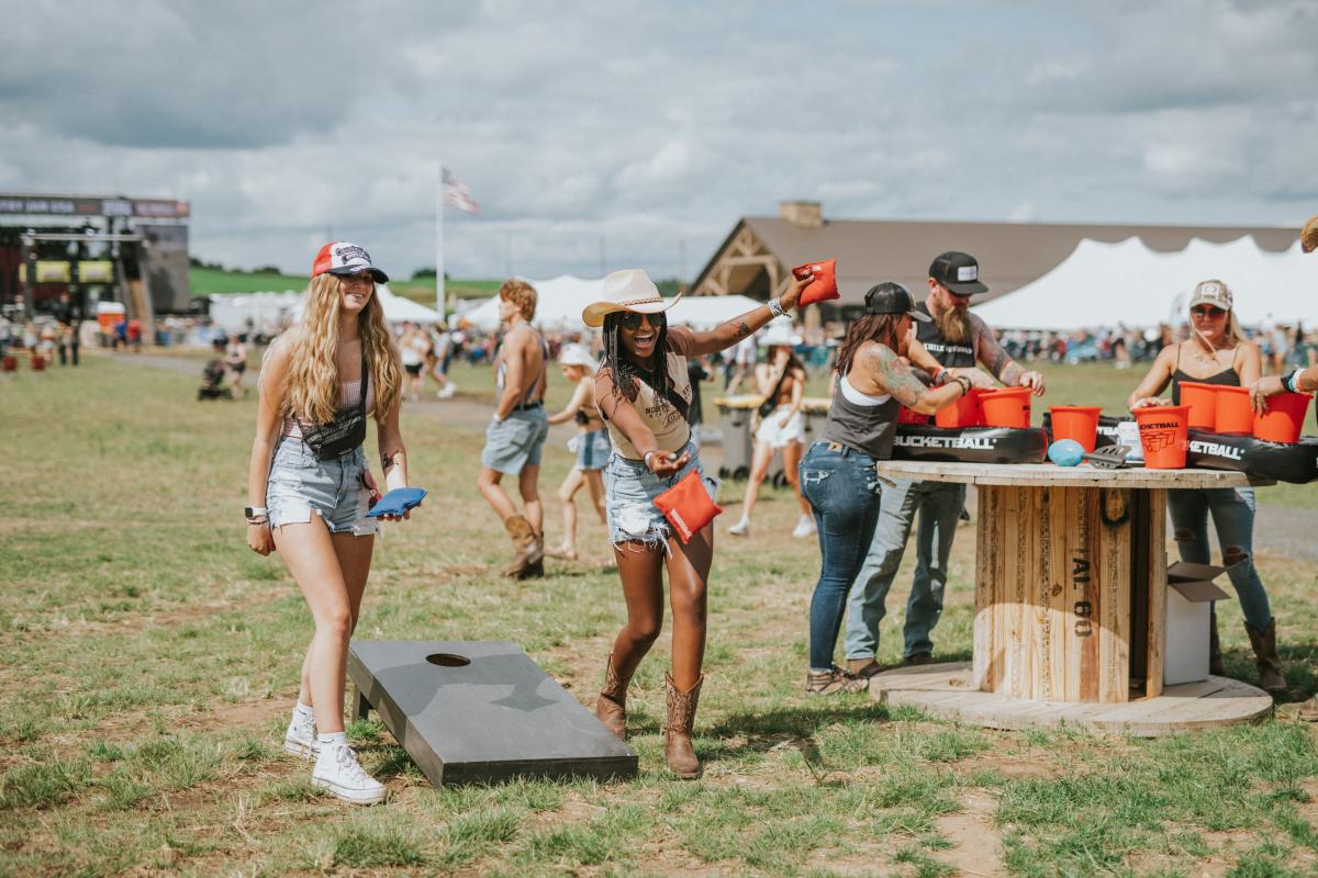 Girls playing bean bags at Country Jam