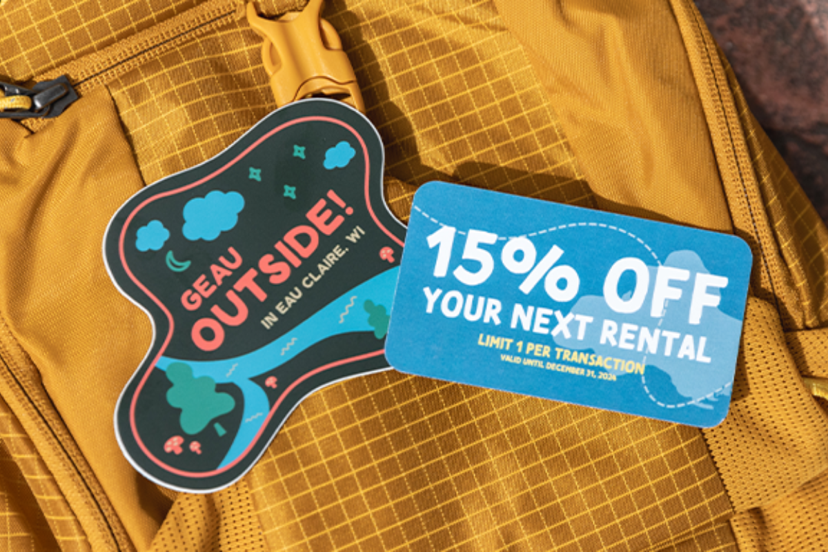 A sticker that says "Geau Outside in Eau Claire, WI" and a coupon for 15% a rental at Eau Claire Outdoors