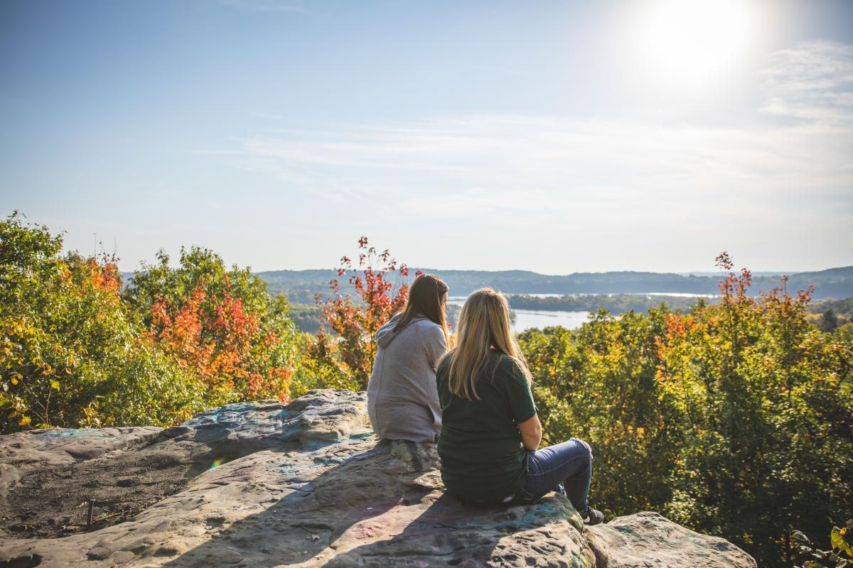 Two women looking at the view at the top of Mt. Simon