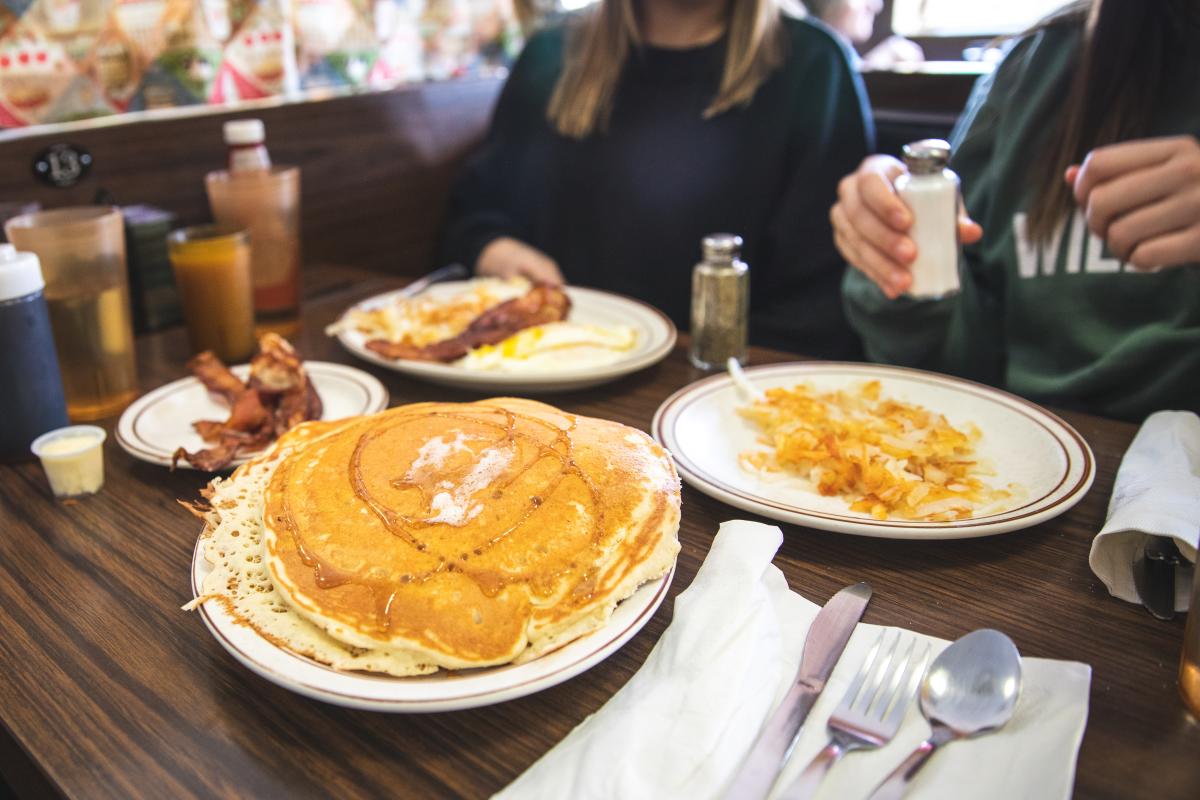 Pancakes, eggs, hashbrowns served at Chick-A-Dee's for breakfast