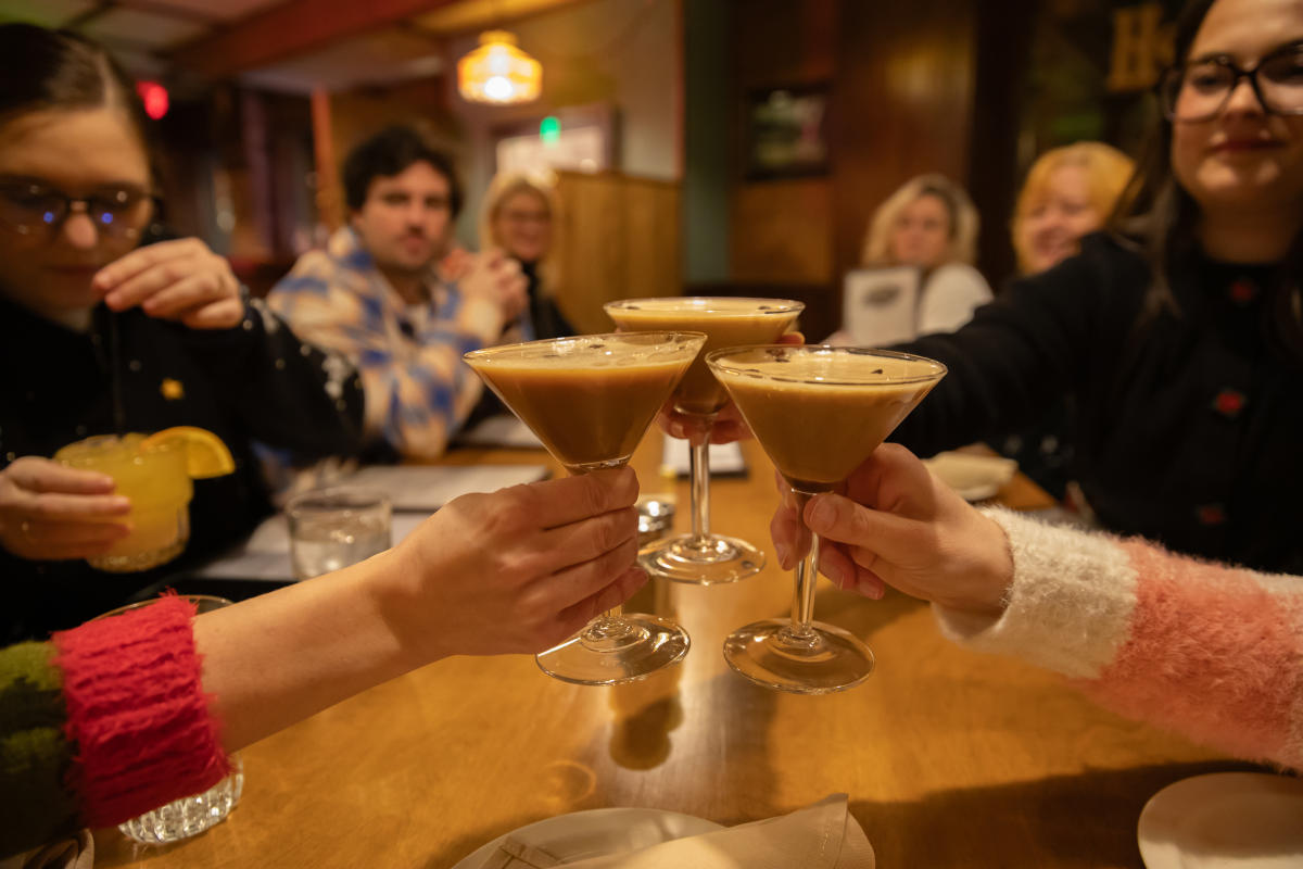 3 espresso martinis clinking together