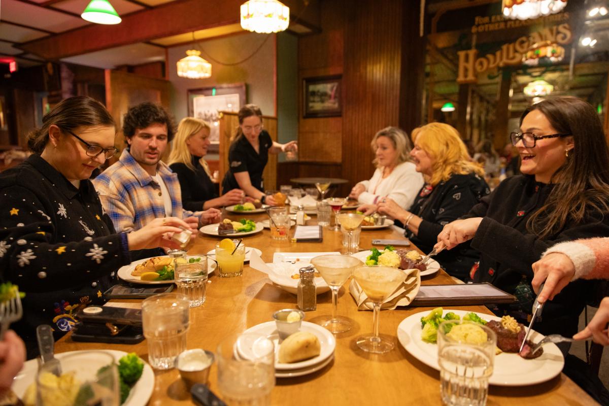 A large group dining at Houligans