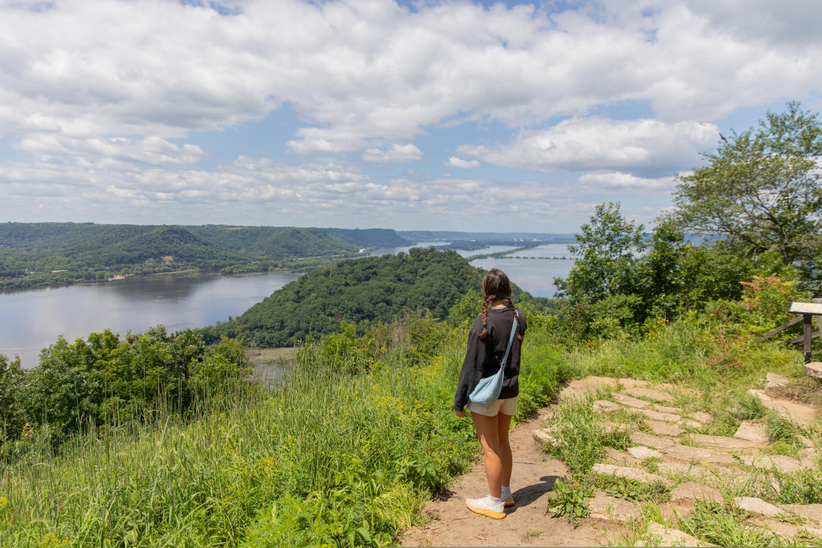 A girl looking at the view after hiking to the top of a bluff at Perrot State Park