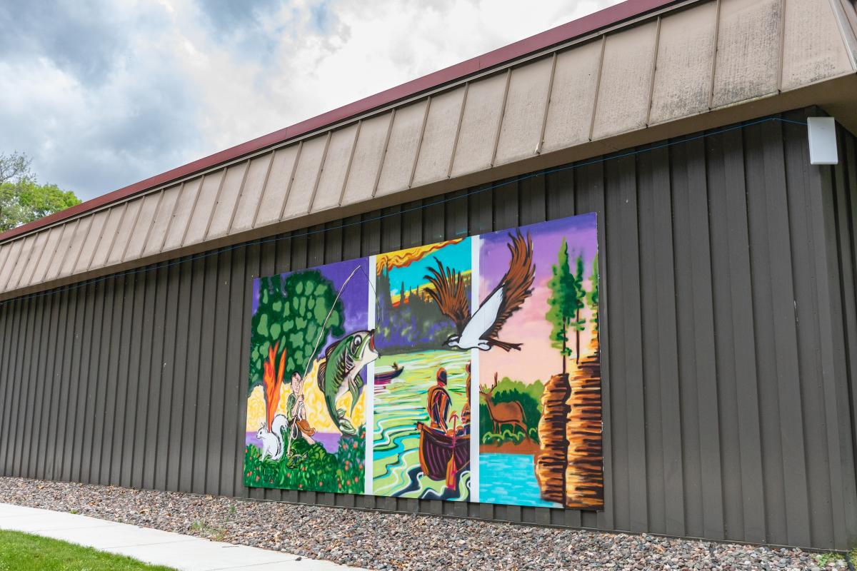 A photo of a colorful mural on the side of the wall at the Chippewa Valley Museum