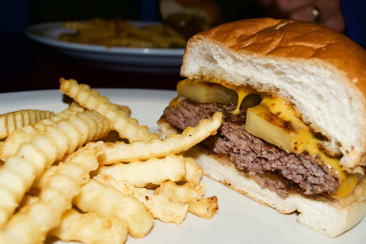 The Pineapple Burger served with fries at the Wigwam in downtown Eau Claire