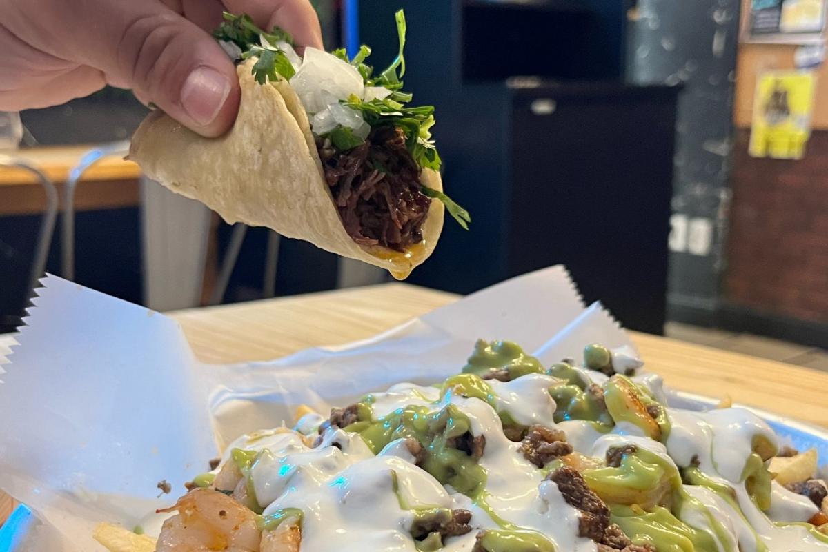 a taco and a papis fries at papis tacos and more
