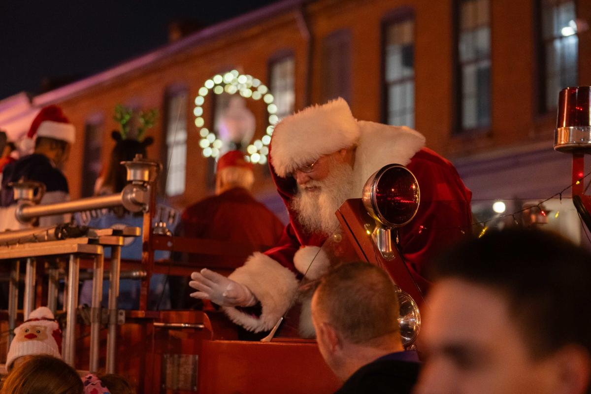 Santa waving to people at Light up Etown