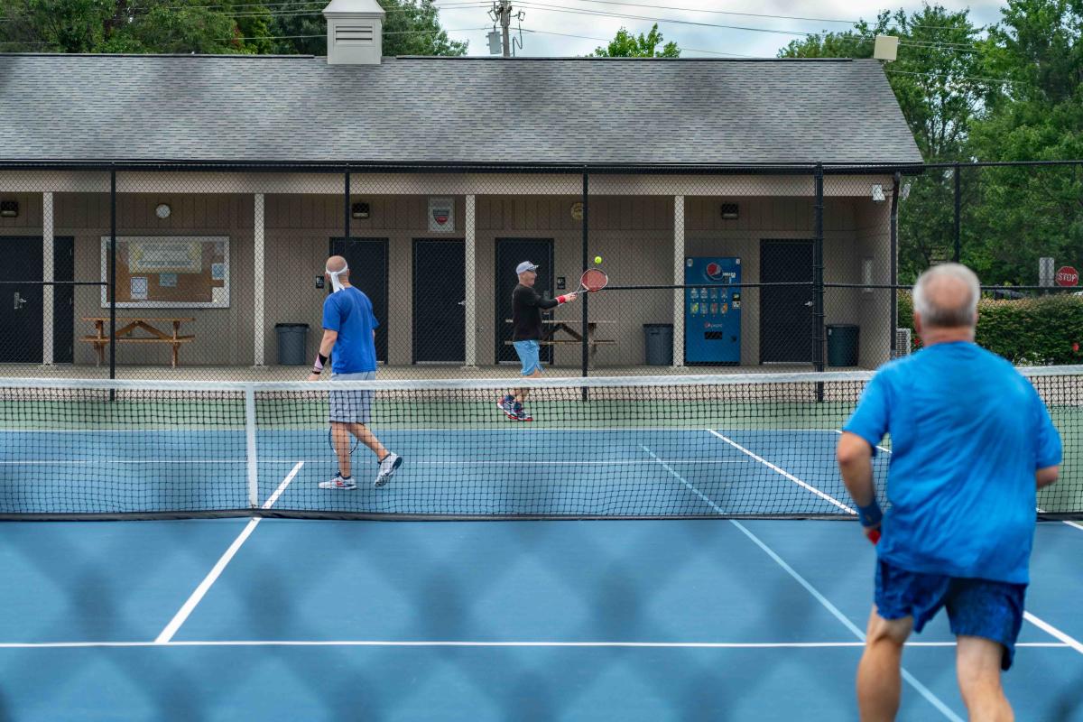 3 people playing tennis at Freeman Lake Park in Elizabethtown, KY