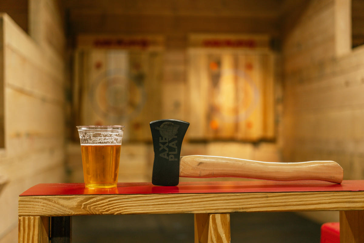 a beer and an axe at axe play