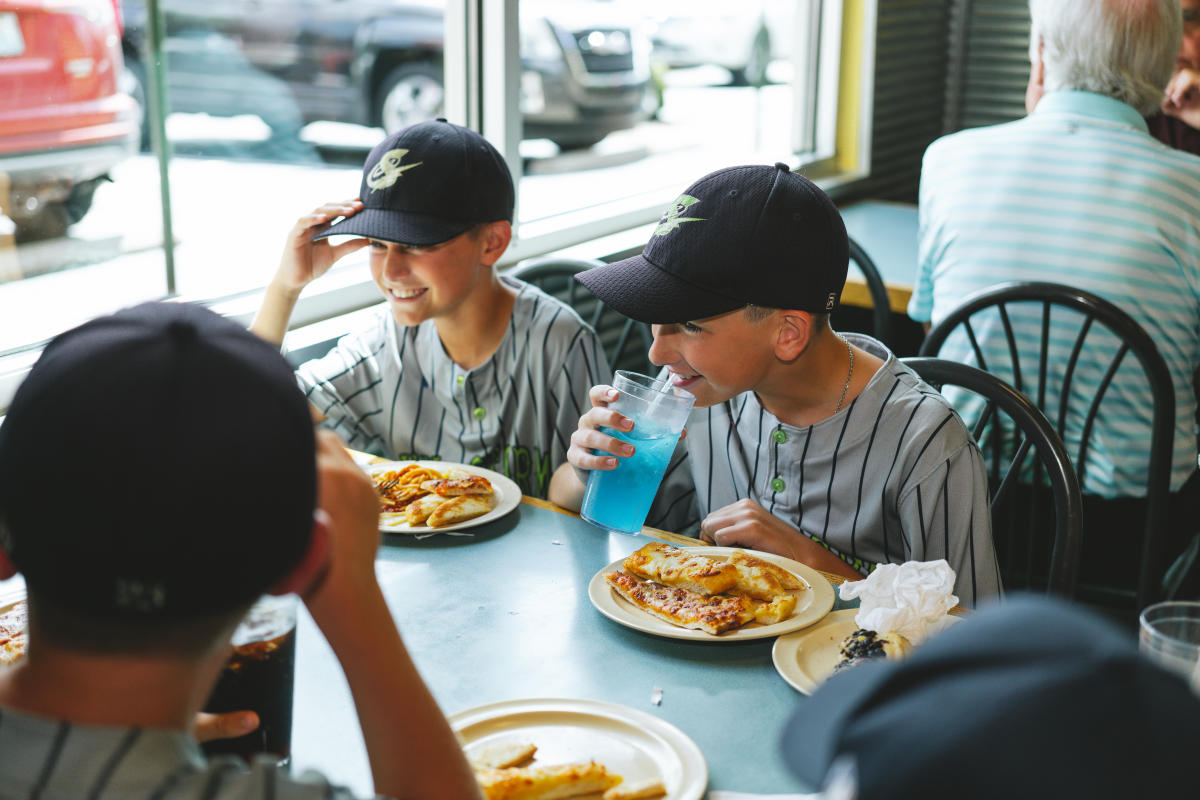 youth baseball players enjoying a meal at mr.gattis