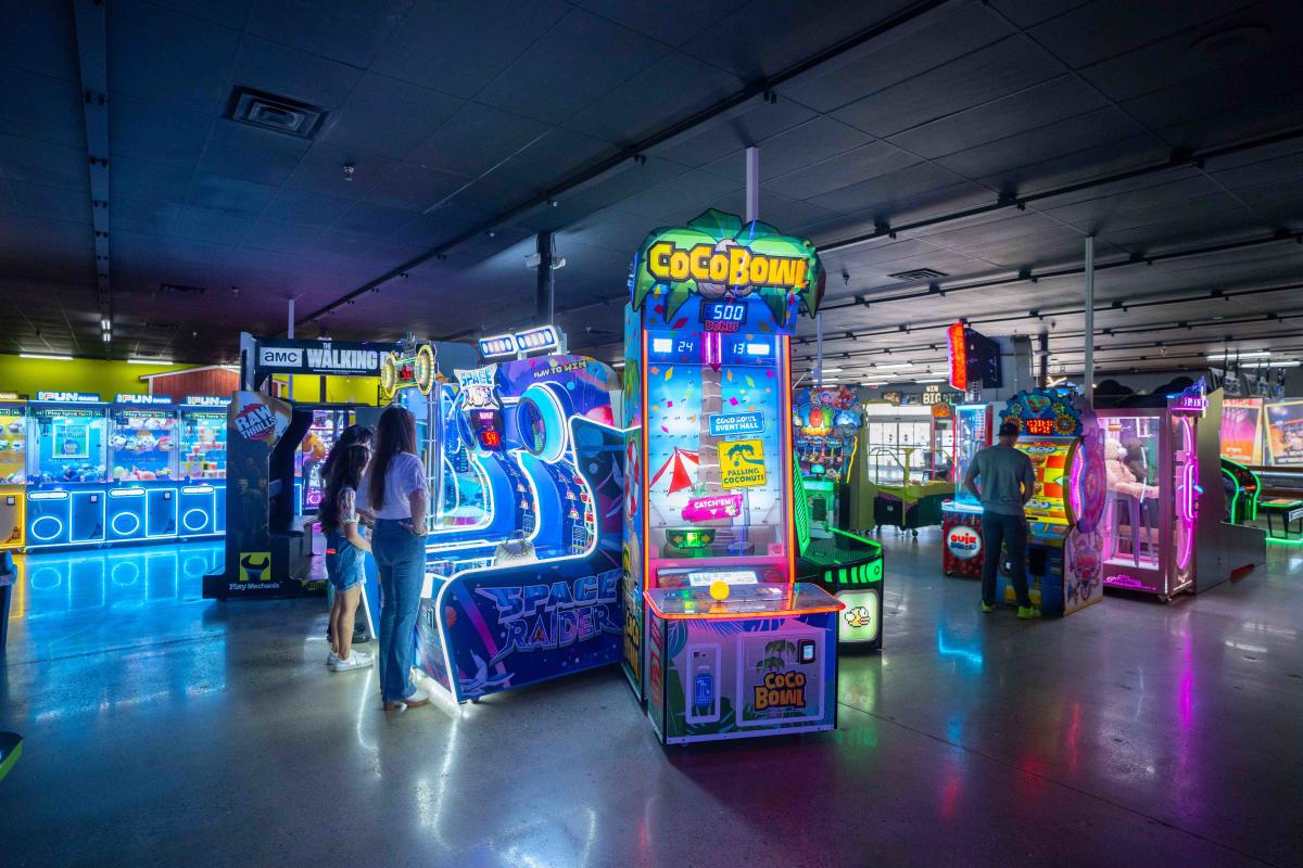 A vibrant arcade scene with colorful gaming machines.
