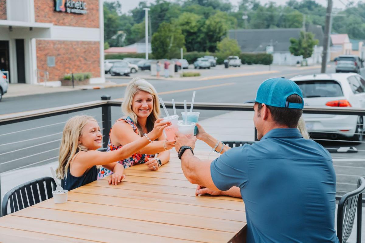 Family cheersing their sodas at Kuddy's Sips and Sweets in Downtown Elizabethtown, KY