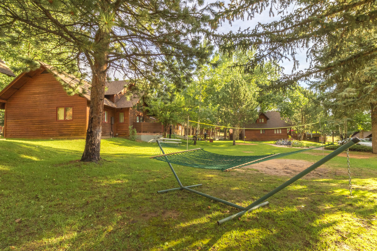 Rams Horn Village Resort grounds showing summer trees and a hammock.