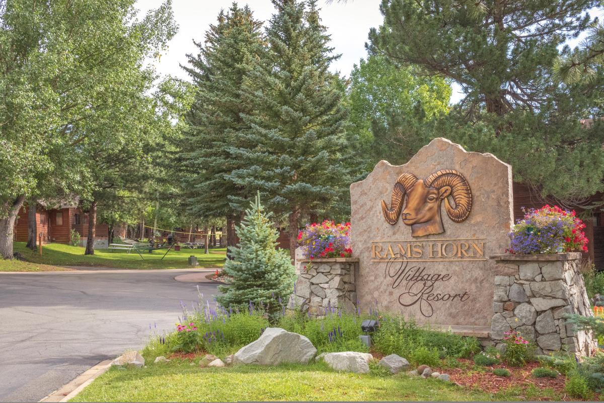 Rams Horn Village Resort entrance sign showing lots of green trees.