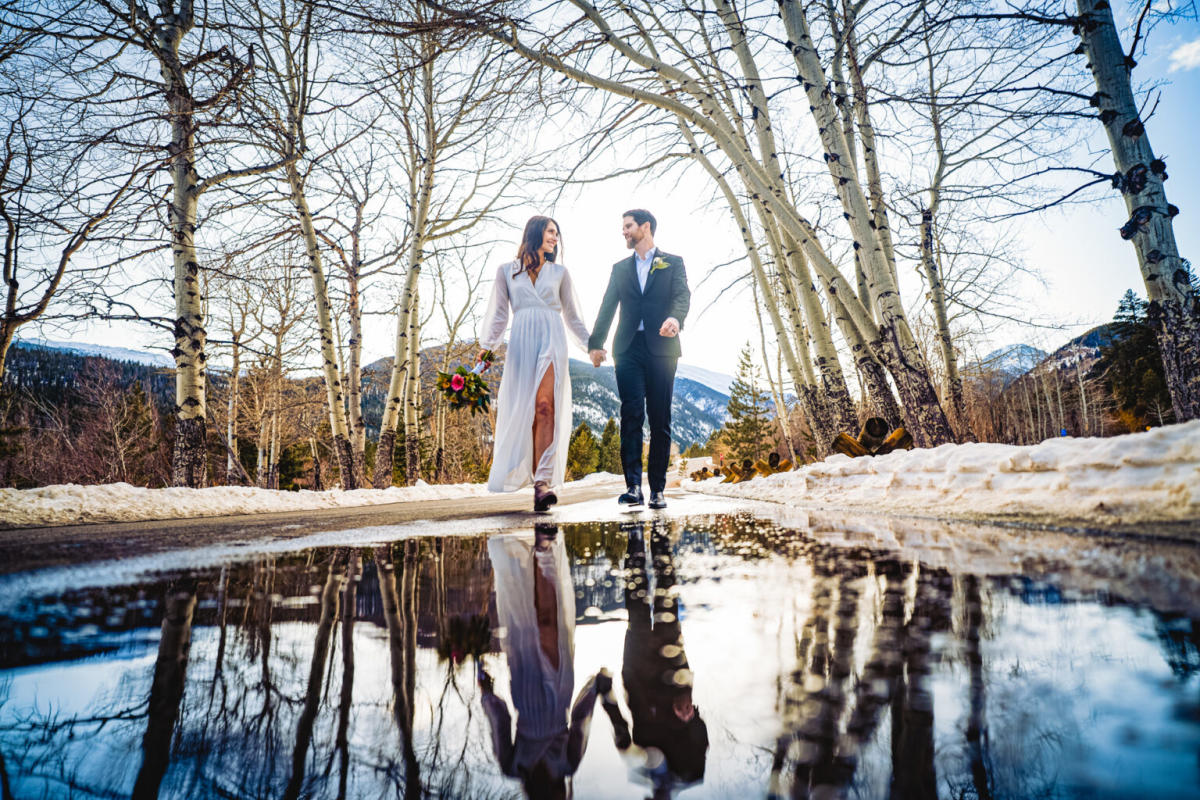 Wedding photo of a couple holding hands in Estes Park