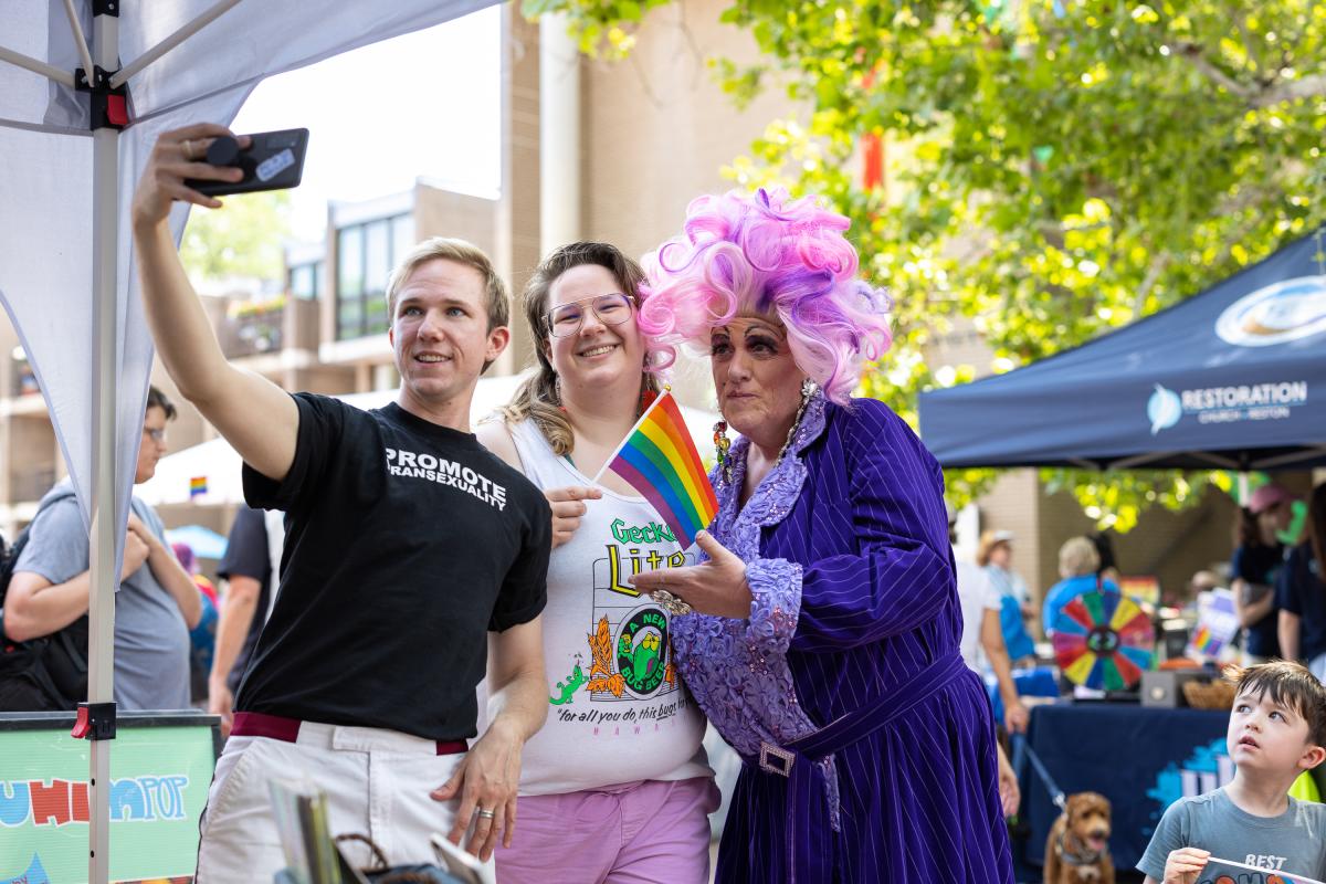 Group taking a selfie during the pride festival at Lake Anne.