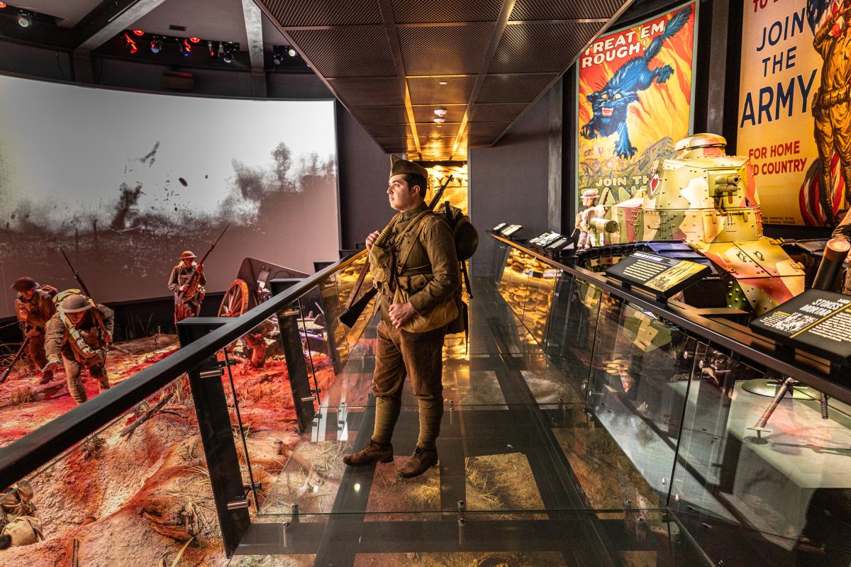 Soldier staring out on the battlefield exhibit.