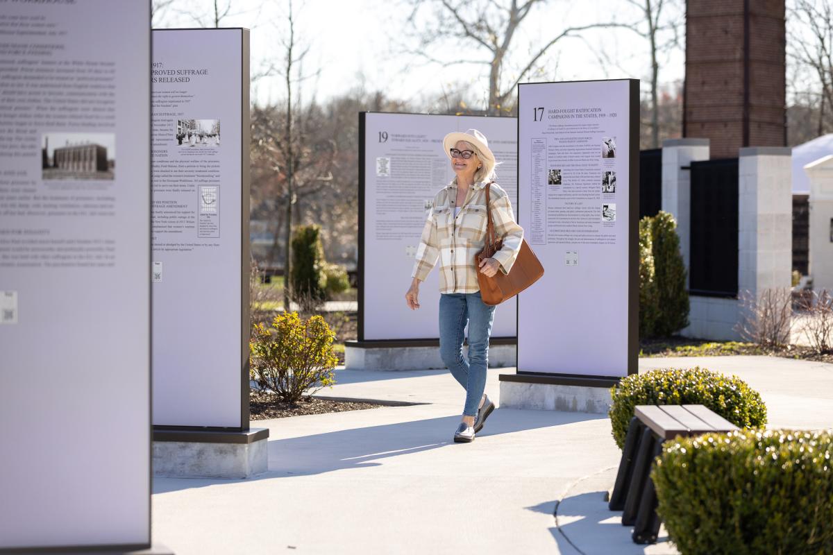 Women walking through the Turning Point Suffragist Memorial