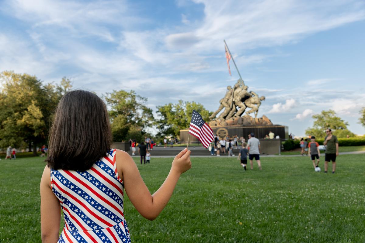 A Child Waving a Flag at the US Marine Corps War Memorial
