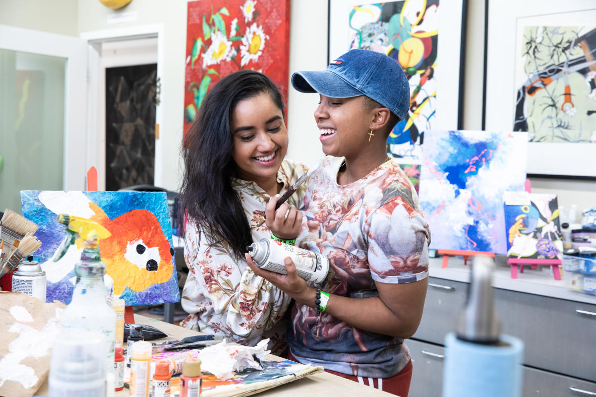 Friends and/or Couple Happily Intertwined While Painting