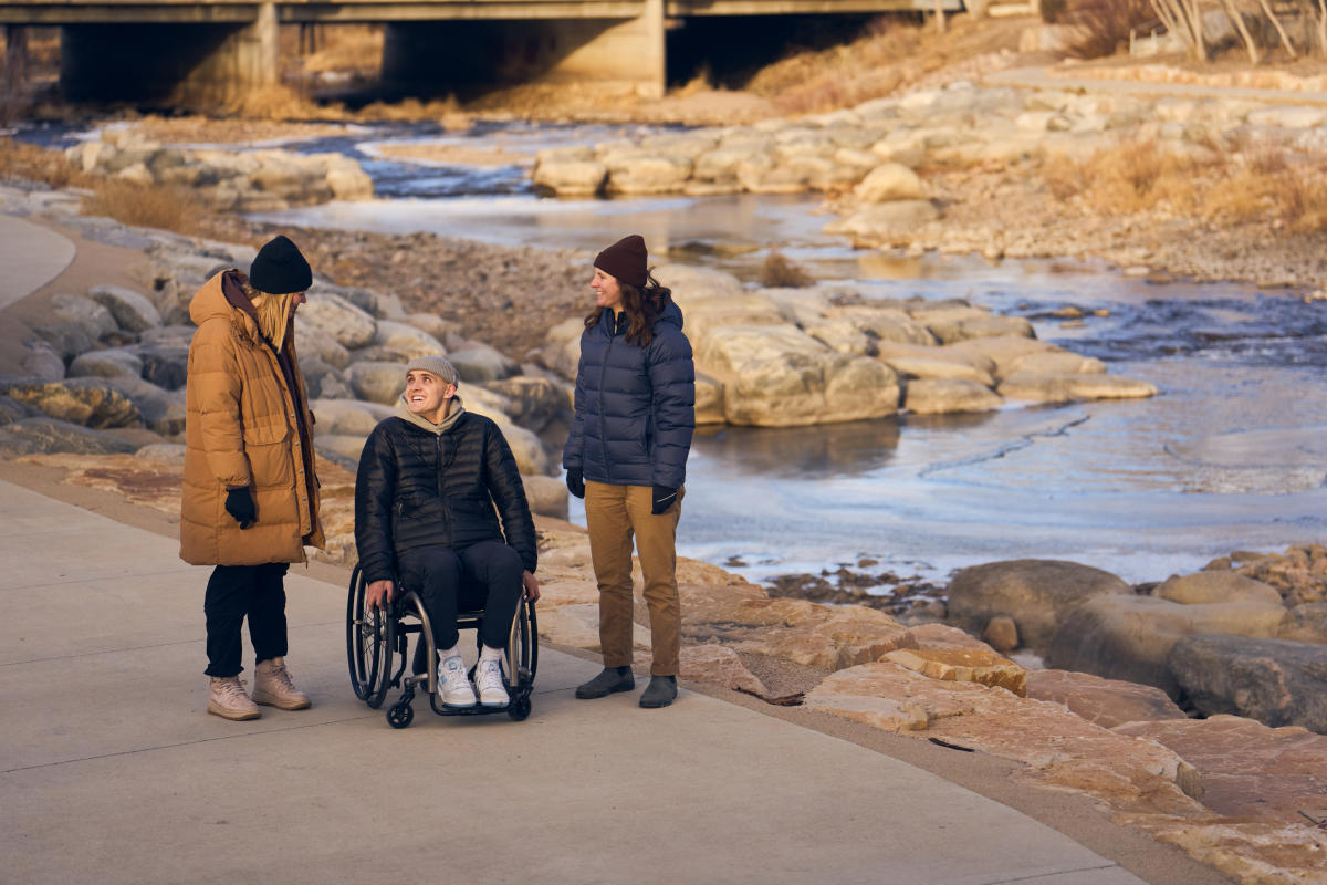 Group walks along Whitewater Park in winter