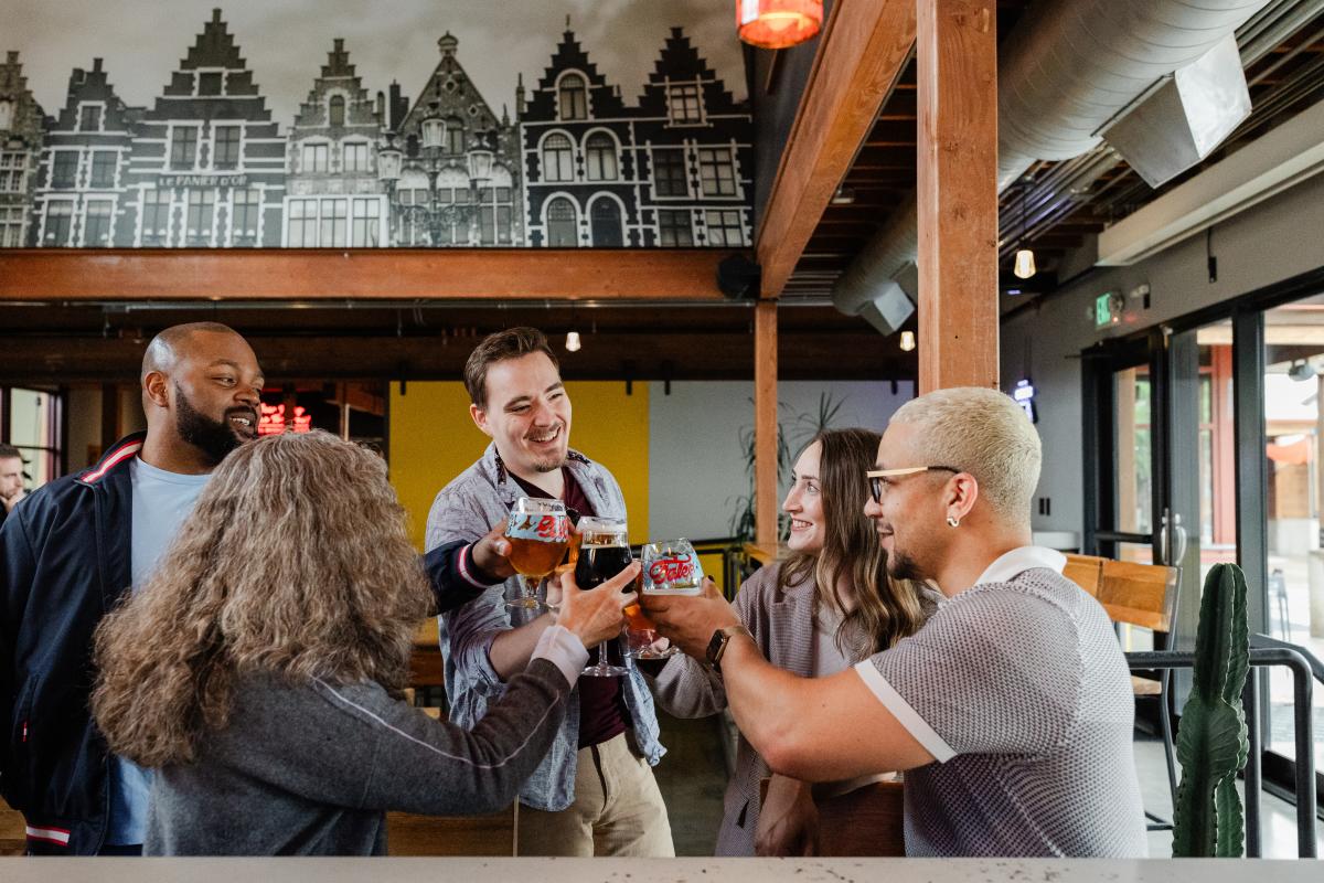 A group of people cheersing at New Belgium Brewery