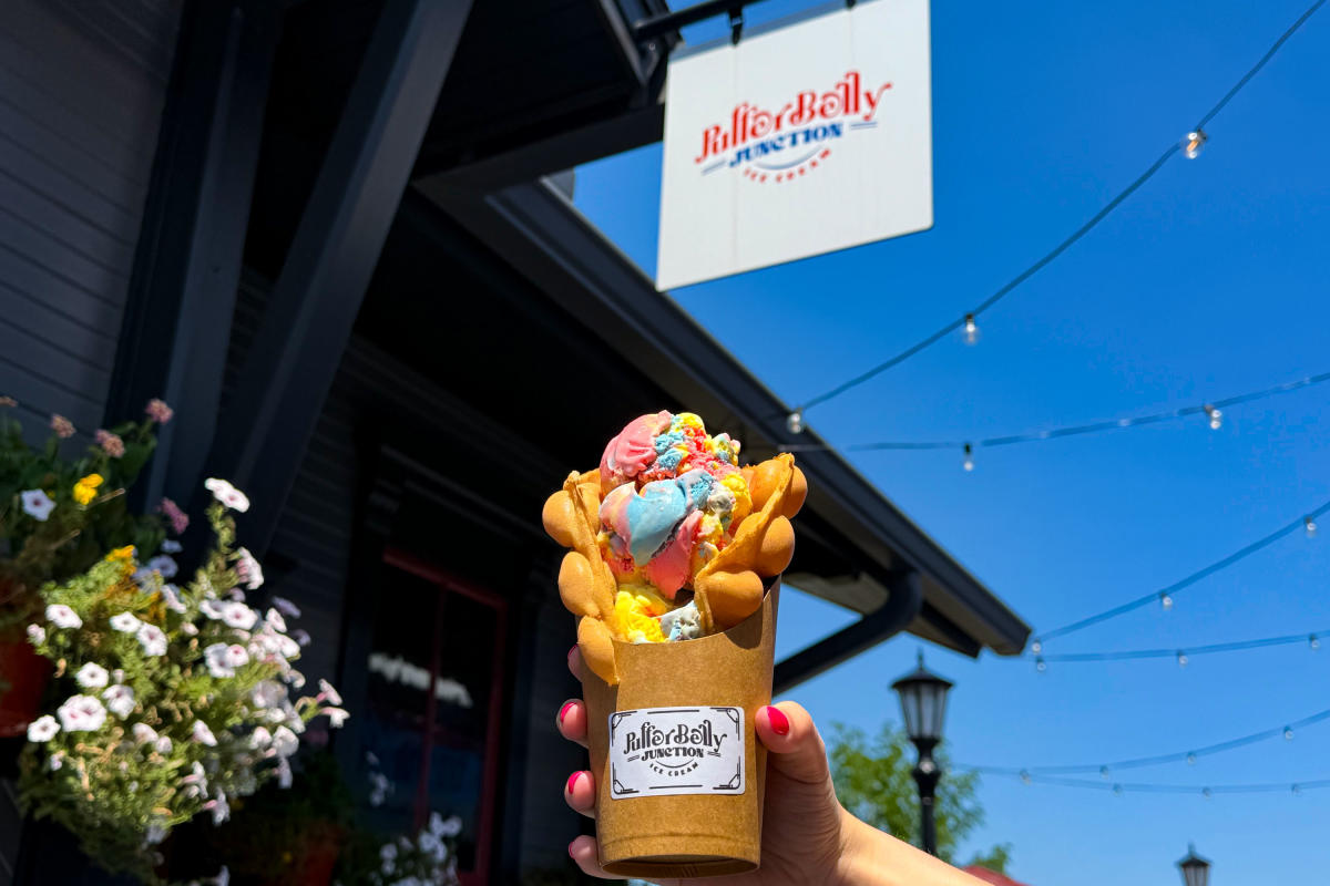 Hand holding Bubble Cone in front of the Pufferbelly Junction Ice Cream Shop in Fort Wayne.