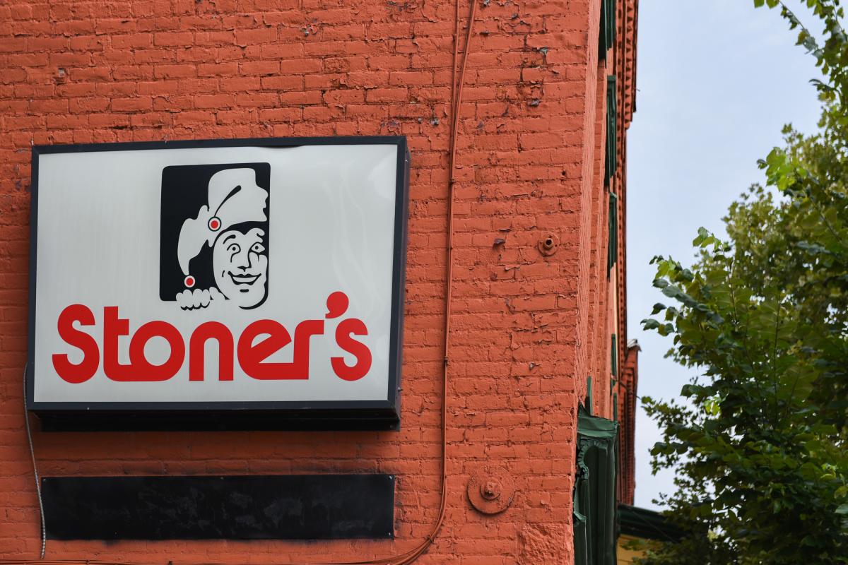 On a red brick wall and sing reads "Stoner's"