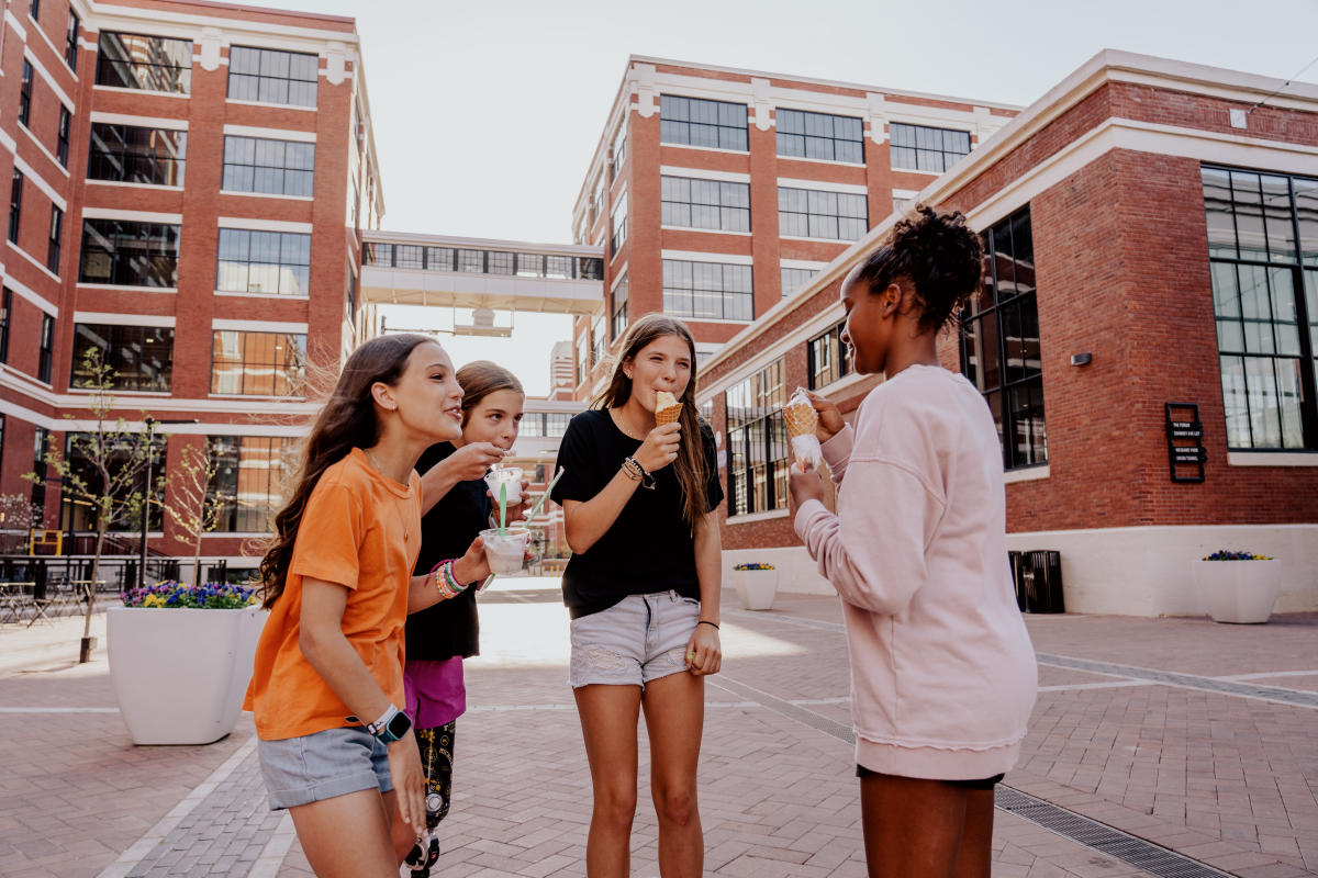 Group of Teens enjoying food at Electric Works in Fort Wayne