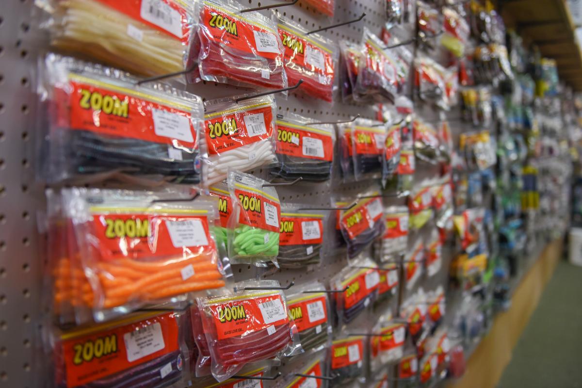 Fishing products hung up on the wall sold at Hook and Arrow