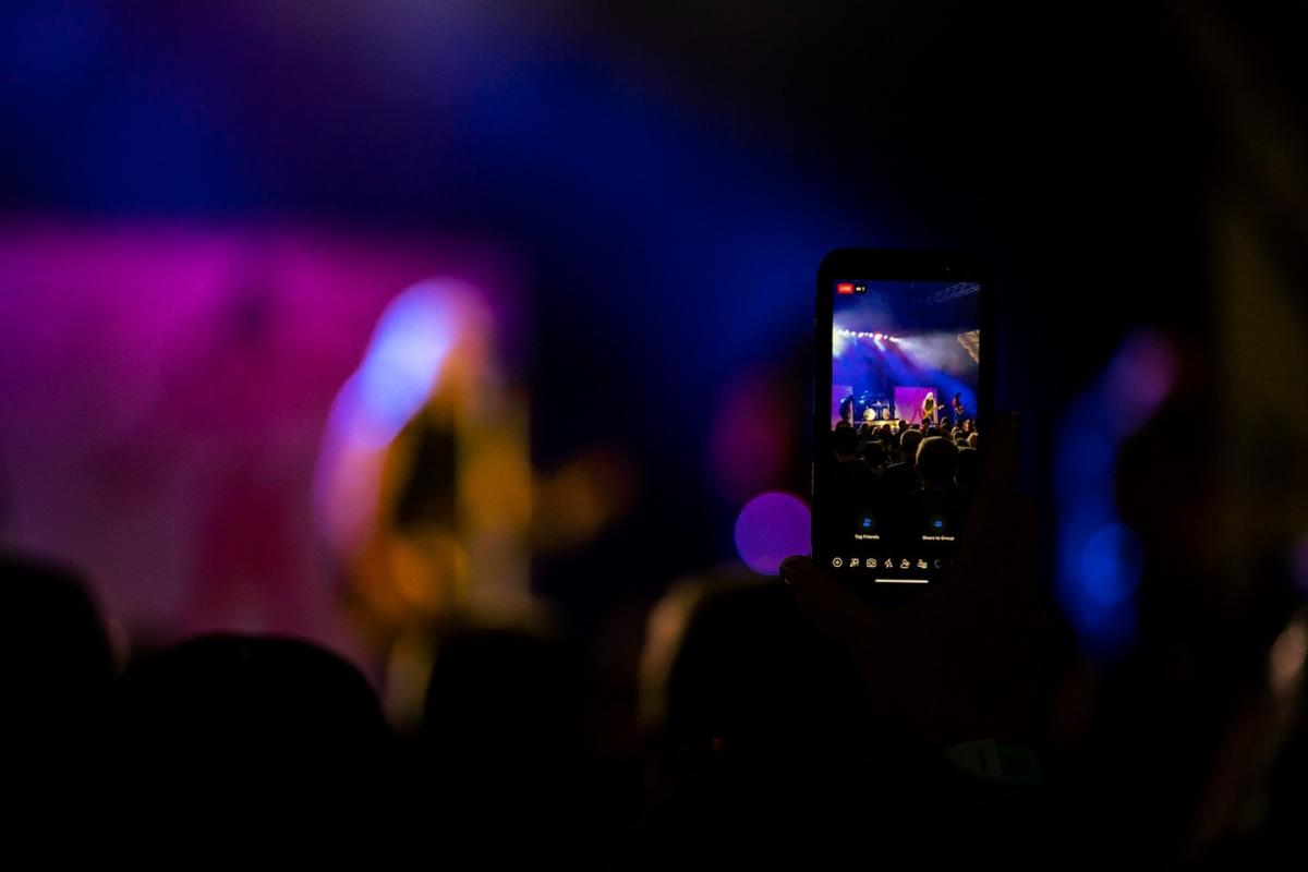 Filming a performer at Sweetwater Pavilion Concert